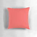 Bright coral-colored pillow with a modern, minimalist design for stylish home decor.