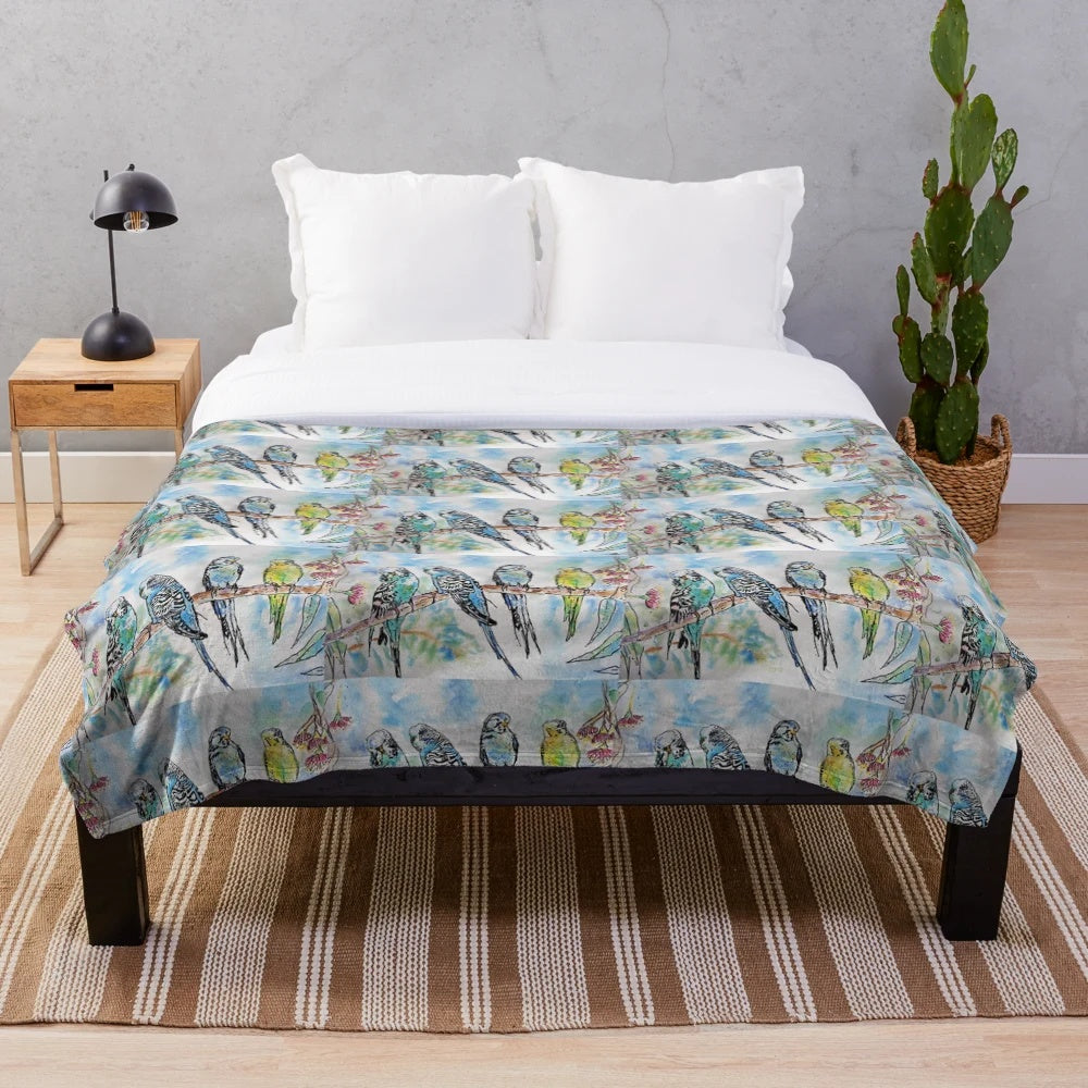 Colorful budgies (Australian parrots) sitting on a branch in a watercolor painting design on a plush blanket