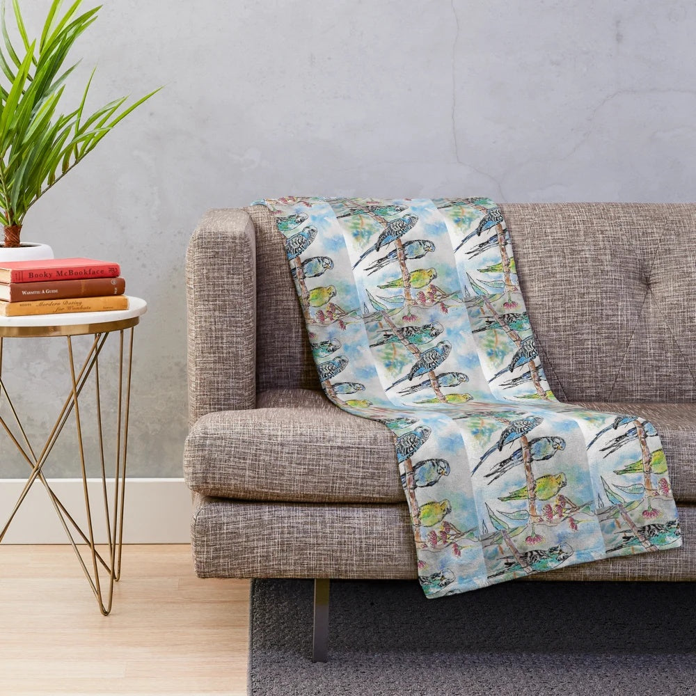 Colorful budgies (Australian parrots) sitting on a branch in a watercolor painting design on a plush blanket