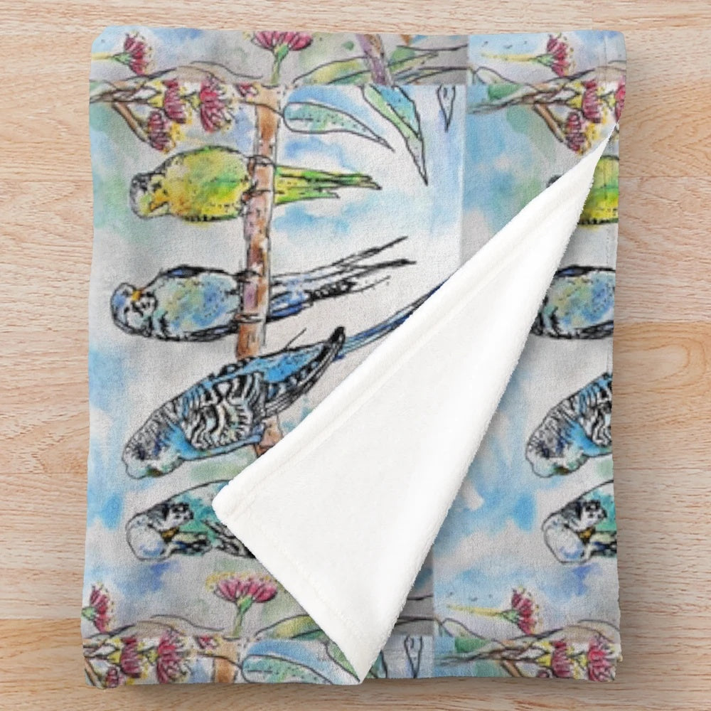 Colorful budgies (Australian parrots) sitting on a branch in a watercolor painting design on a plush blanket