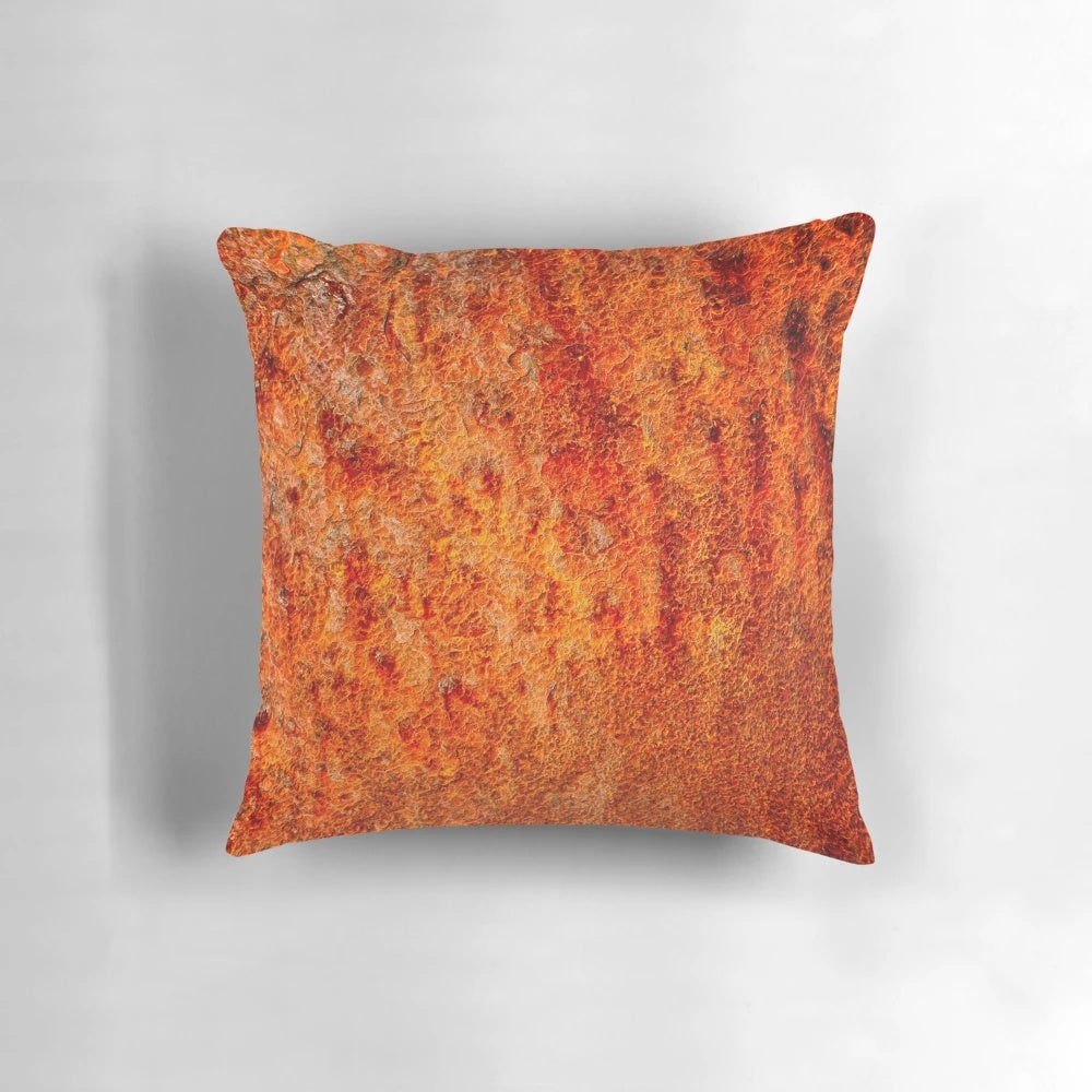 Burnt orange decorative pillow with textured abstract design