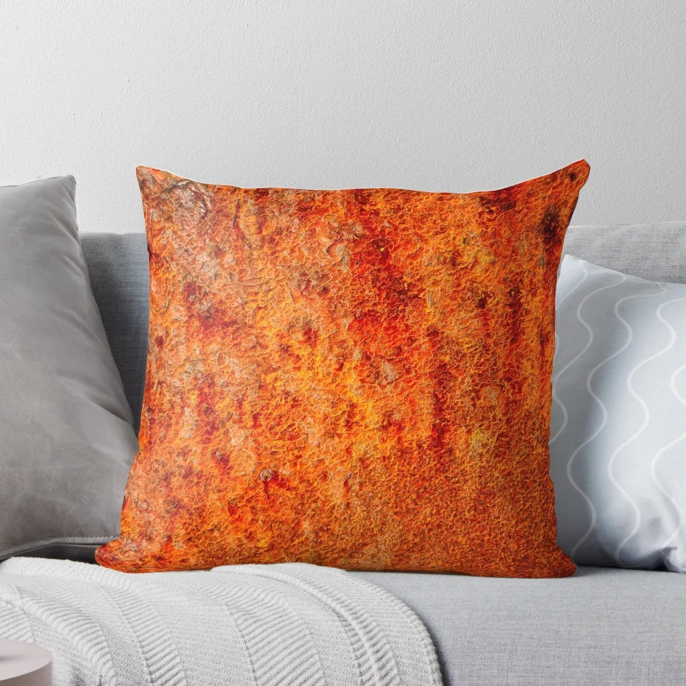 Burnt orange decorative pillow with textured abstract design