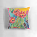 Decorative pillow featuring a colorful cactus blossom design in a southwestern style