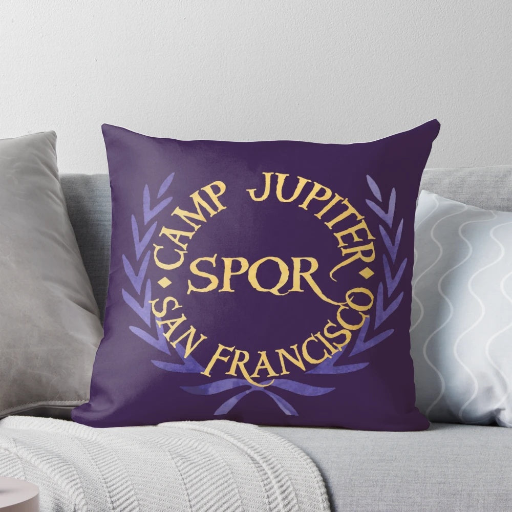 Colorful watercolor-style camp jupiter pillow featuring the logo from the Percy Jackson book series