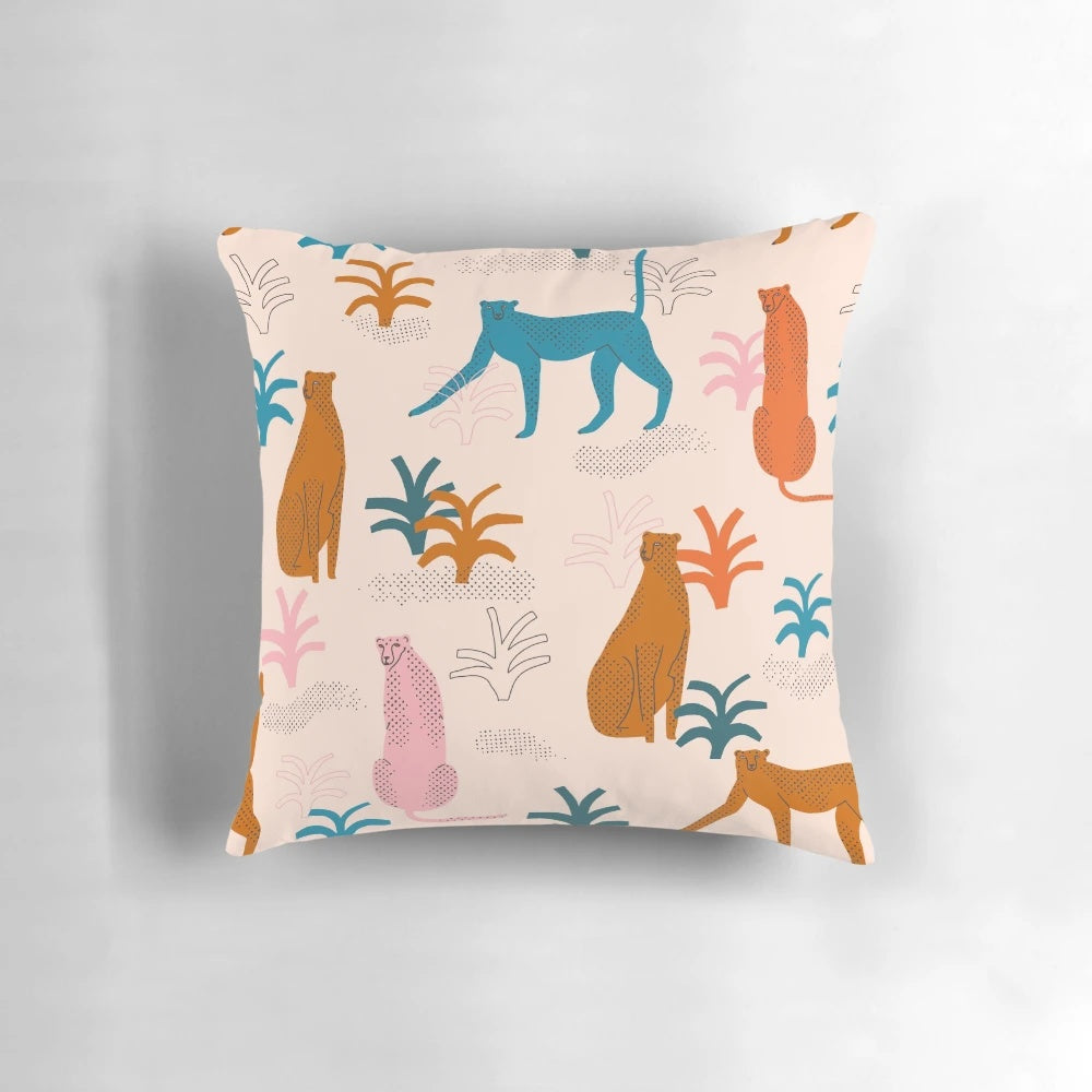 Colorful throw pillow featuring a majestic cheetah in a lush jungle setting