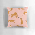 Closeup view of a pink and white cheetah pattern printed on a decorative throw pillow.