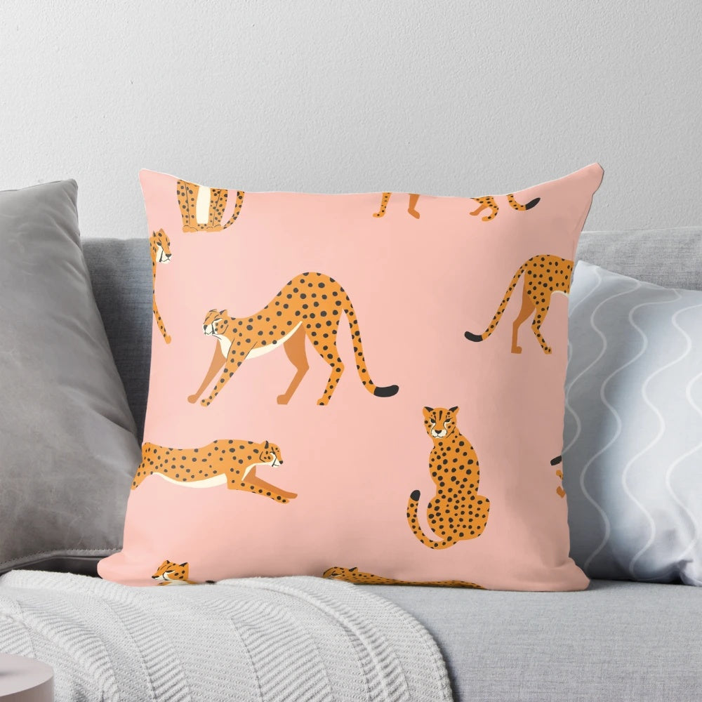 Closeup view of a pink and white cheetah pattern printed on a decorative throw pillow.