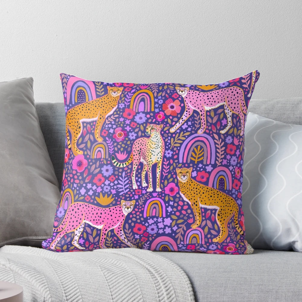 Stunning navy blue throw pillow featuring a colorful illustration of cheetahs in a rainbow garden