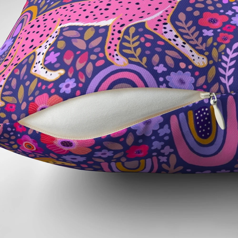 Stunning navy blue throw pillow featuring a colorful illustration of cheetahs in a rainbow garden