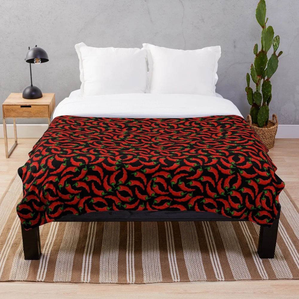 Cozy plush blanket with a vibrant chili pepper pattern design