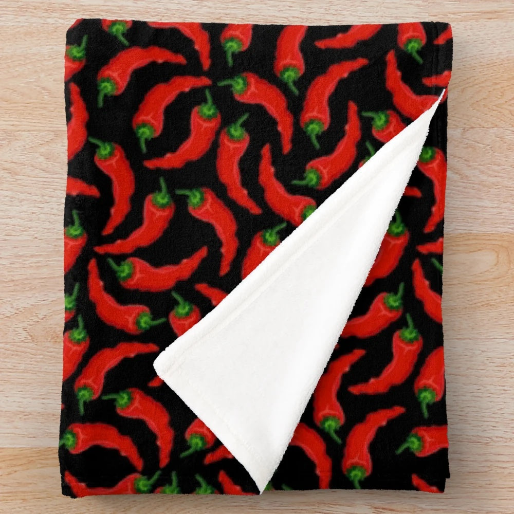 Cozy plush blanket with a vibrant chili pepper pattern design