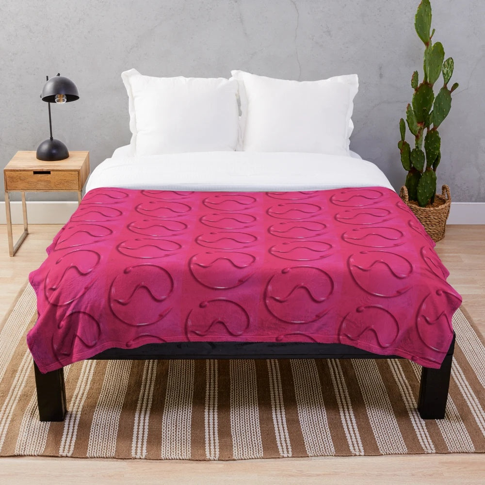 A plush, soft blanket featuring the Chromatica logo from Lady Gaga's album