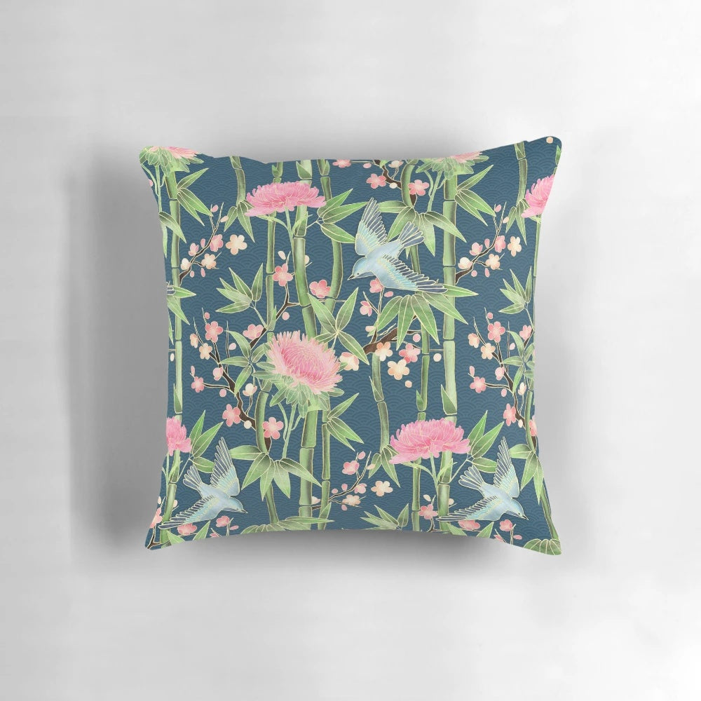 Decorative pillow cover featuring a vibrant pattern of chrysanthemums, birds, and bamboo in shades of teal, pink, and green.