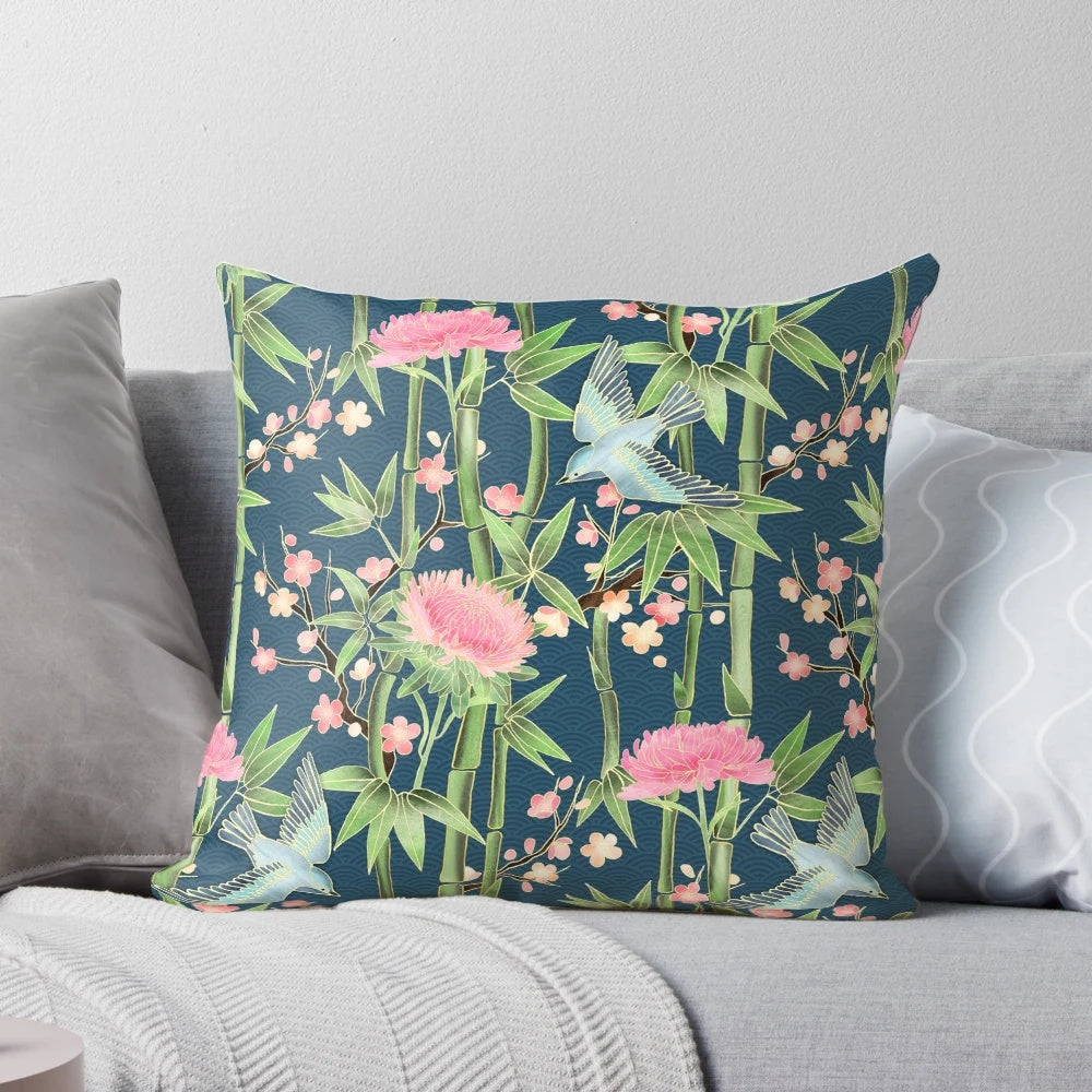 Decorative pillow cover featuring a vibrant pattern of chrysanthemums, birds, and bamboo in shades of teal, pink, and green.