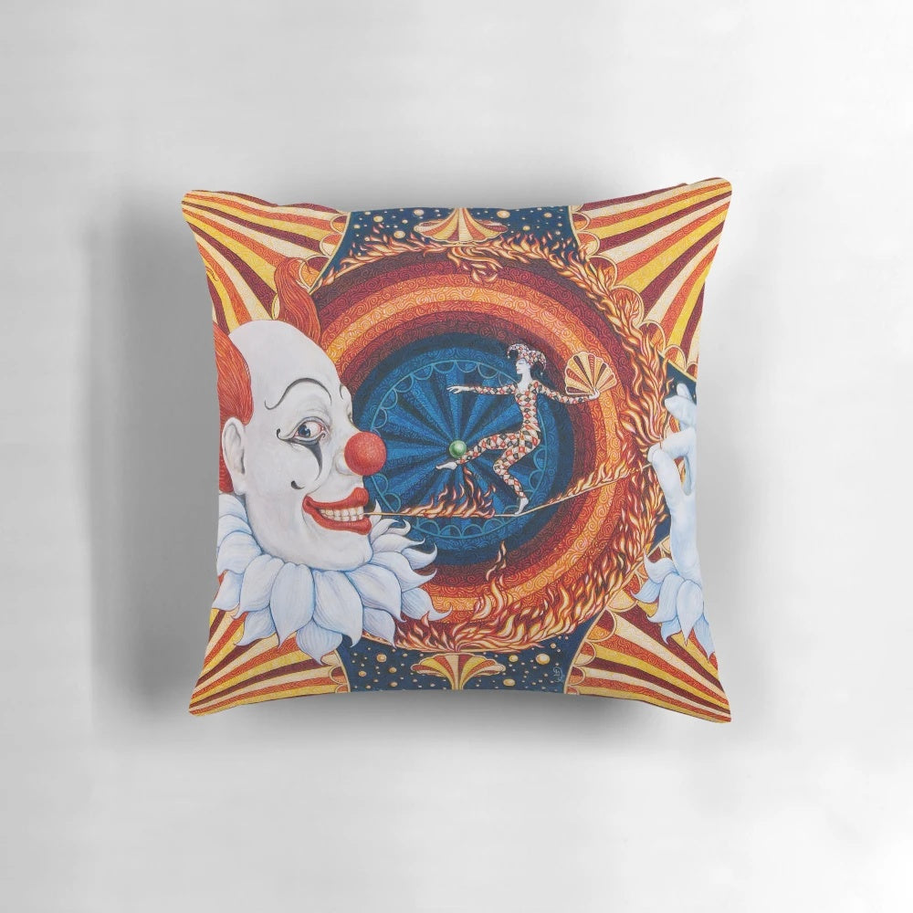 Colorful and whimsical circus-themed pillow with clowns, fire, and bright circles