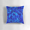 Cobalt blue and black geometric faceted pillow with abstract circle and shape pattern