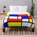 Piet Mondrian-inspired color block plush blanket in red, yellow, and blue