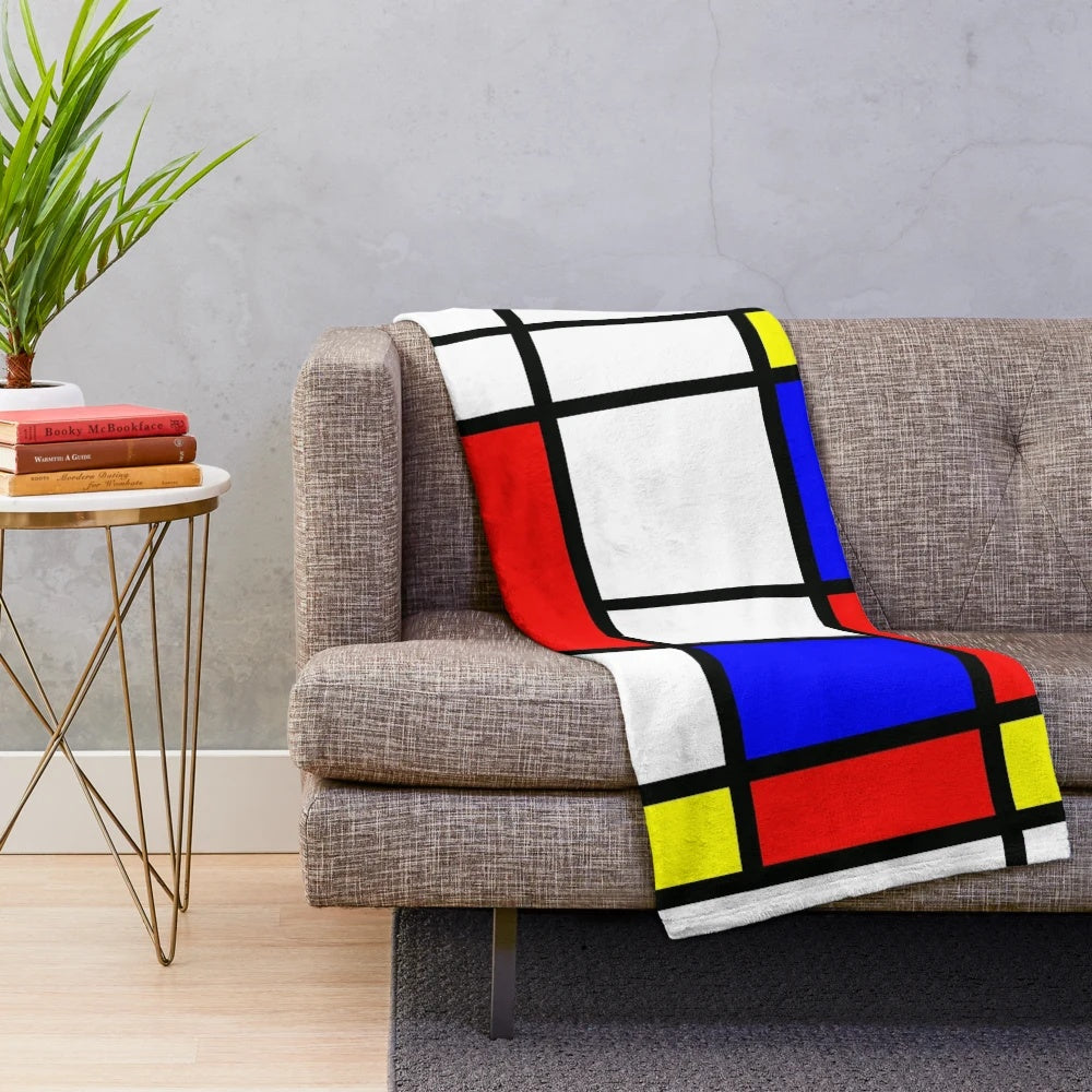 Piet Mondrian-inspired color block plush blanket in red, yellow, and blue