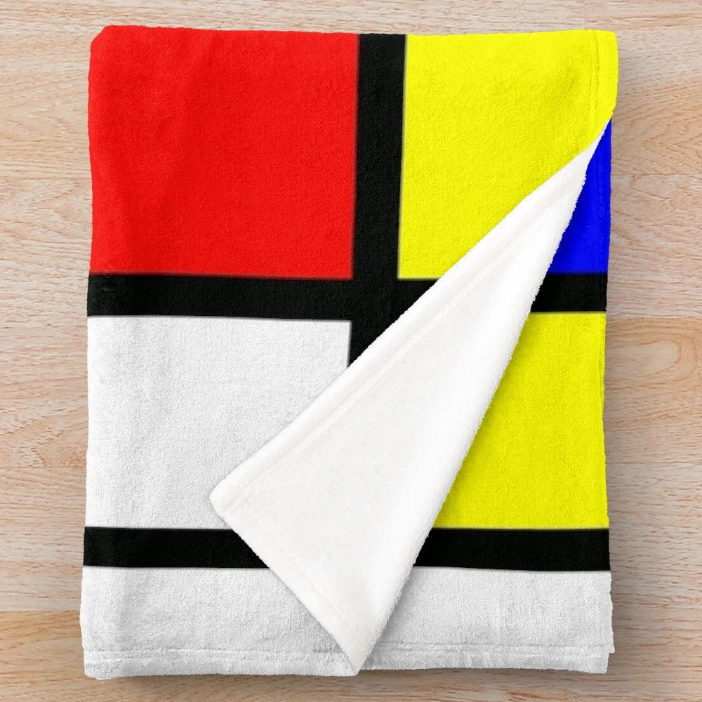 Piet Mondrian-inspired color block plush blanket in red, yellow, and blue