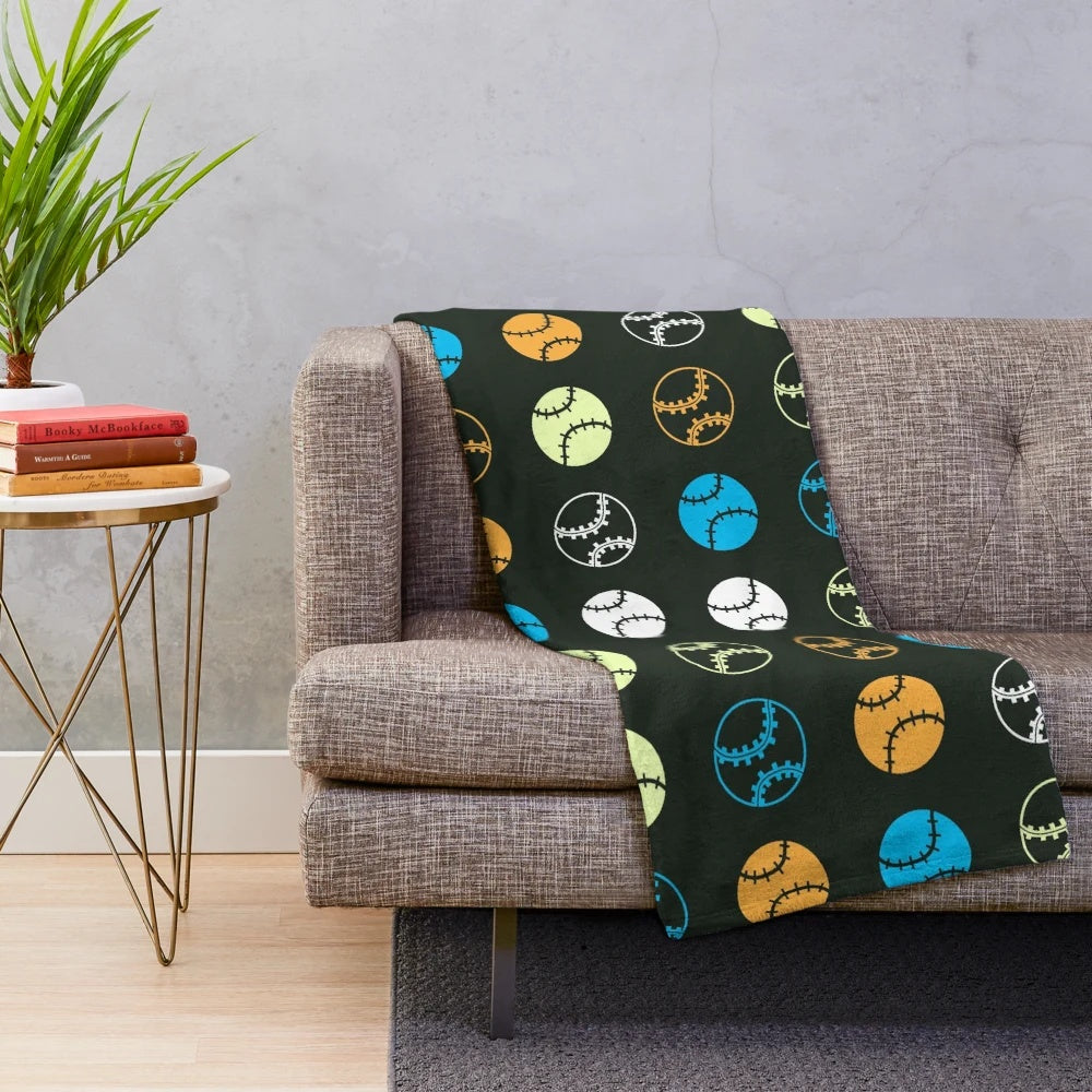 Colorful plush blanket featuring a gradient pattern of baseball icons