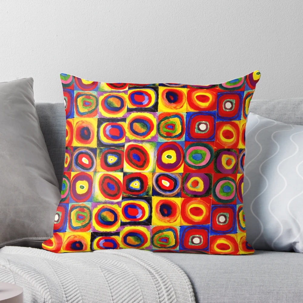 Colorful abstract art throw pillow featuring geometric circles and squares in a modern, Kandinsky-inspired design
