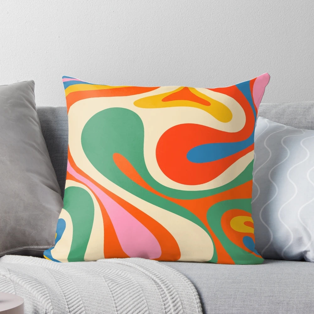 Vibrant, colorful abstract pattern on a modern throw pillow with a retro, psychedelic design.
