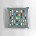 Colorful rain pillow with abstract graphic and multicolored droplet design