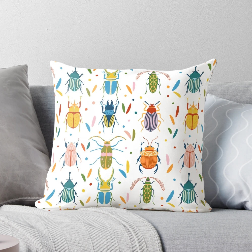 Colourful beetles print on a decorative pillow, showcasing the diverse and whimsical patterns of nature's insects.