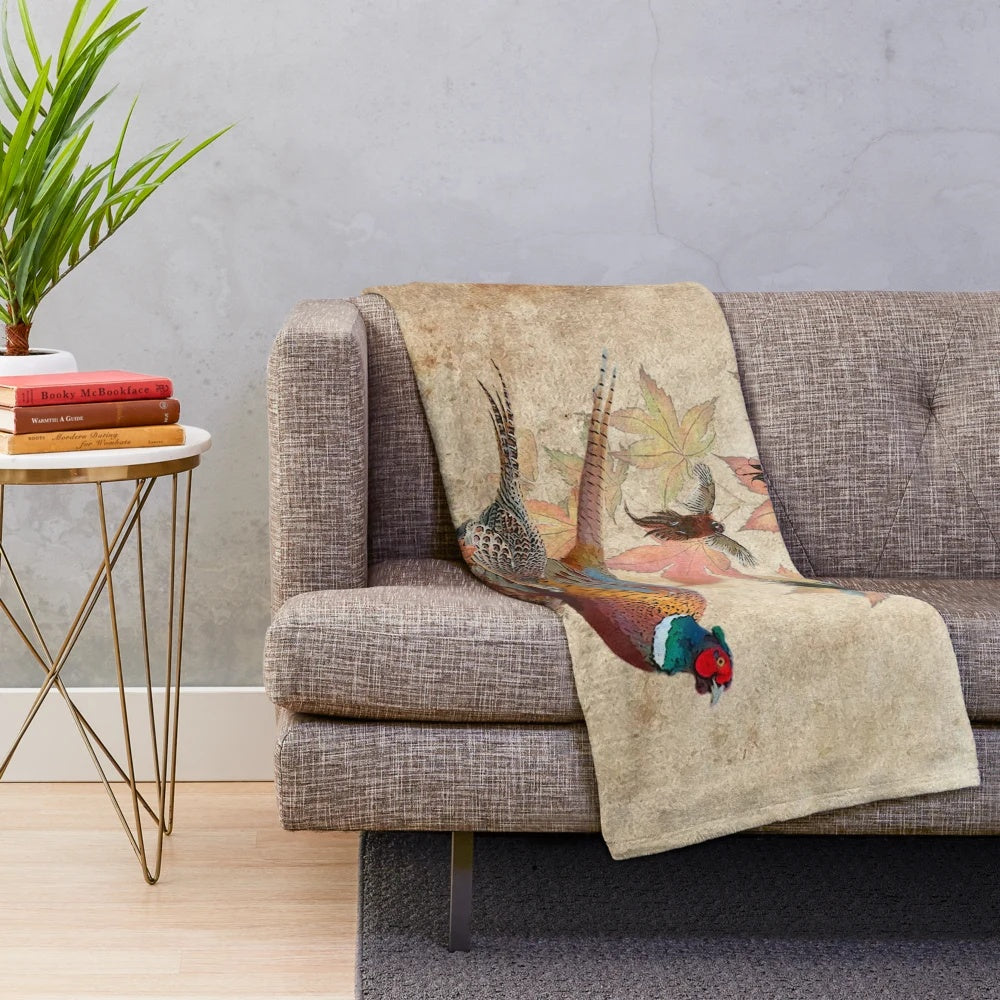 Common pheasant plush blanket with vibrant feathers and natural grass