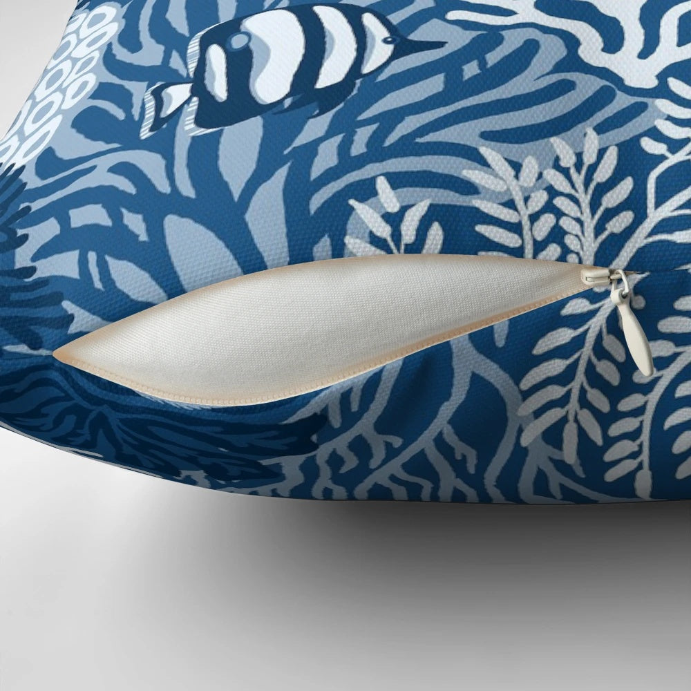 Colorful coral reef design on a classic blue pillow