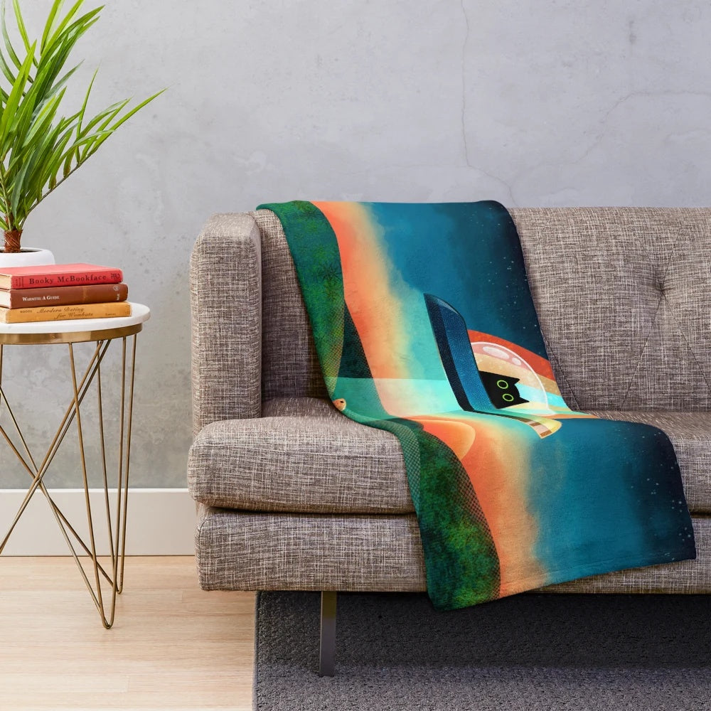 Colorful plush blanket featuring an alien cat design in a cosmic, galaxy-inspired pattern