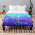 Vibrant plush blanket with a cosmic stars aesthetic pattern
