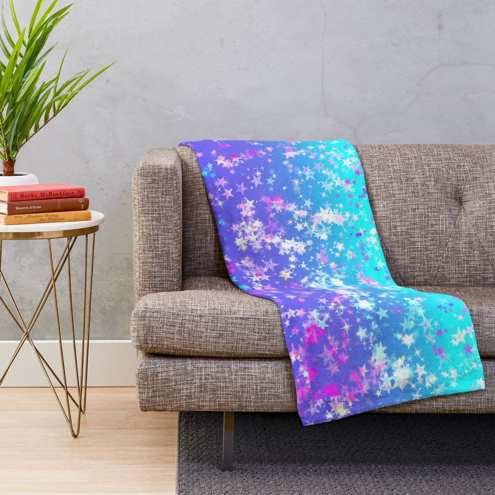 Vibrant plush blanket with a cosmic stars aesthetic pattern