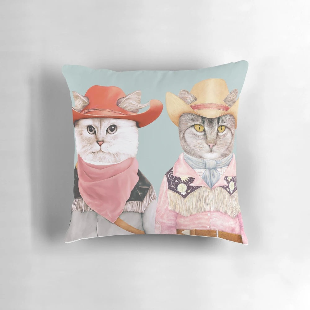 Colorful and fun pillow featuring a group of cartoon cats dressed up as cowboys and cowgirls.