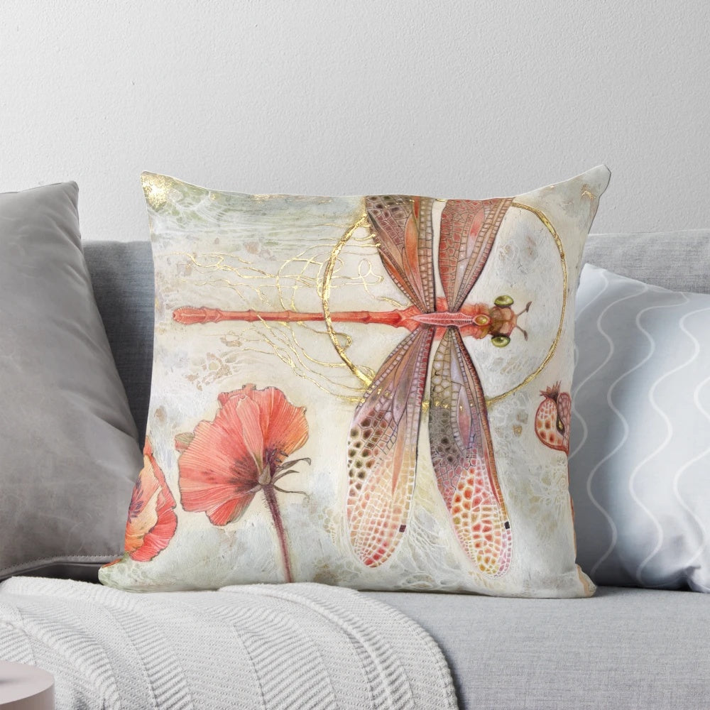 Vibrant red jewel damselfly with delicate wings in a stained glass design on a decorative throw pillow