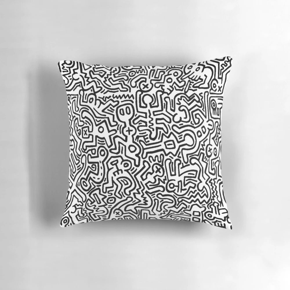 A black and white pillow with abstract dancing figures, evoking a modern, artistic aesthetic.