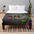 Smiling pit bull with sugar skull design on a plush blanket