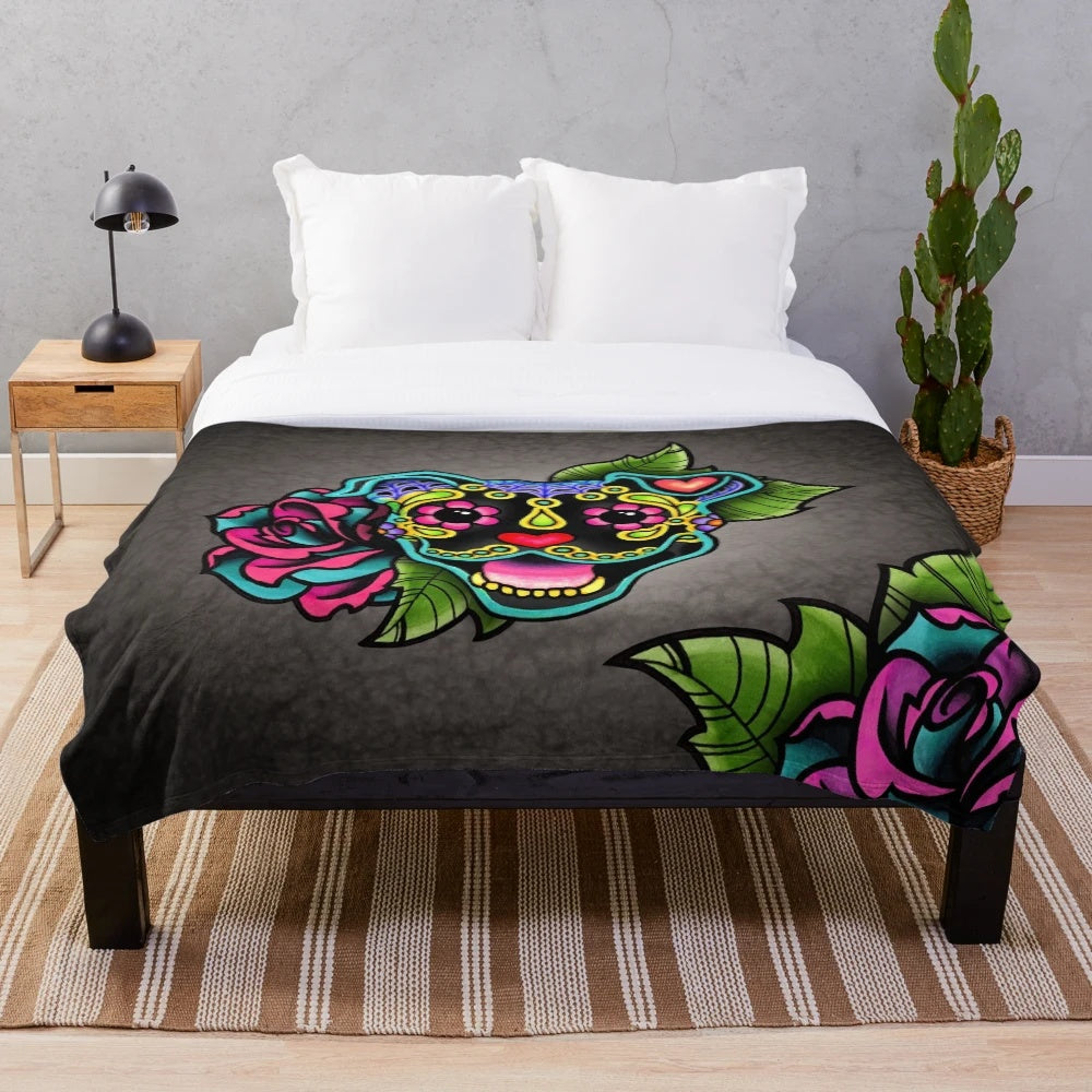 Smiling pit bull with sugar skull design on a plush blanket