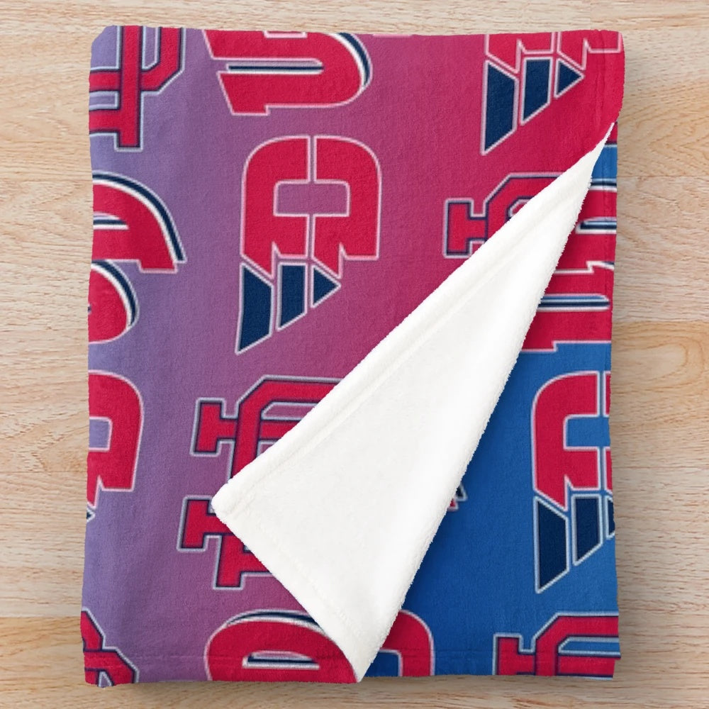 University of Dayton Flyers-inspired plush blanket with red, white, and blue gradient pattern