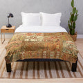 Colorful bohemian plush blanket in desert sage tones