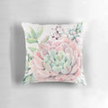 Colorful illustration of pink and green desert succulents on a decorative pillow