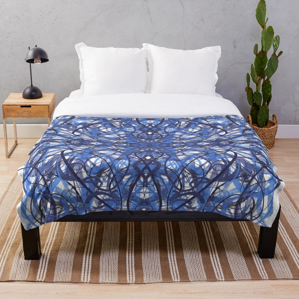 Plush blanket with digital symmetry design in blue tones