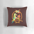Colorful pillow featuring an orange bird and tiki room design, inspired by the Sunshine Tree Terrace at Walt Disney World.