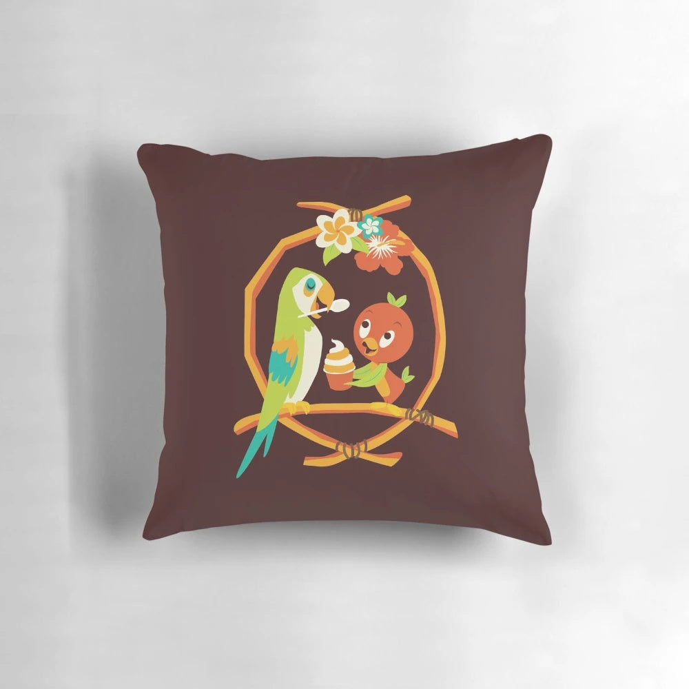 Colorful pillow featuring an orange bird and tiki room design, inspired by the Sunshine Tree Terrace at Walt Disney World.