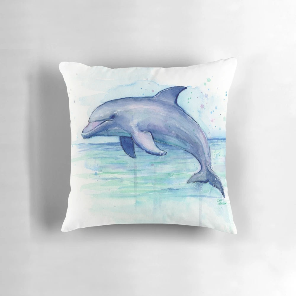 Colorful watercolor painting of a dolphin printed on a plush, decorative throw pillow.