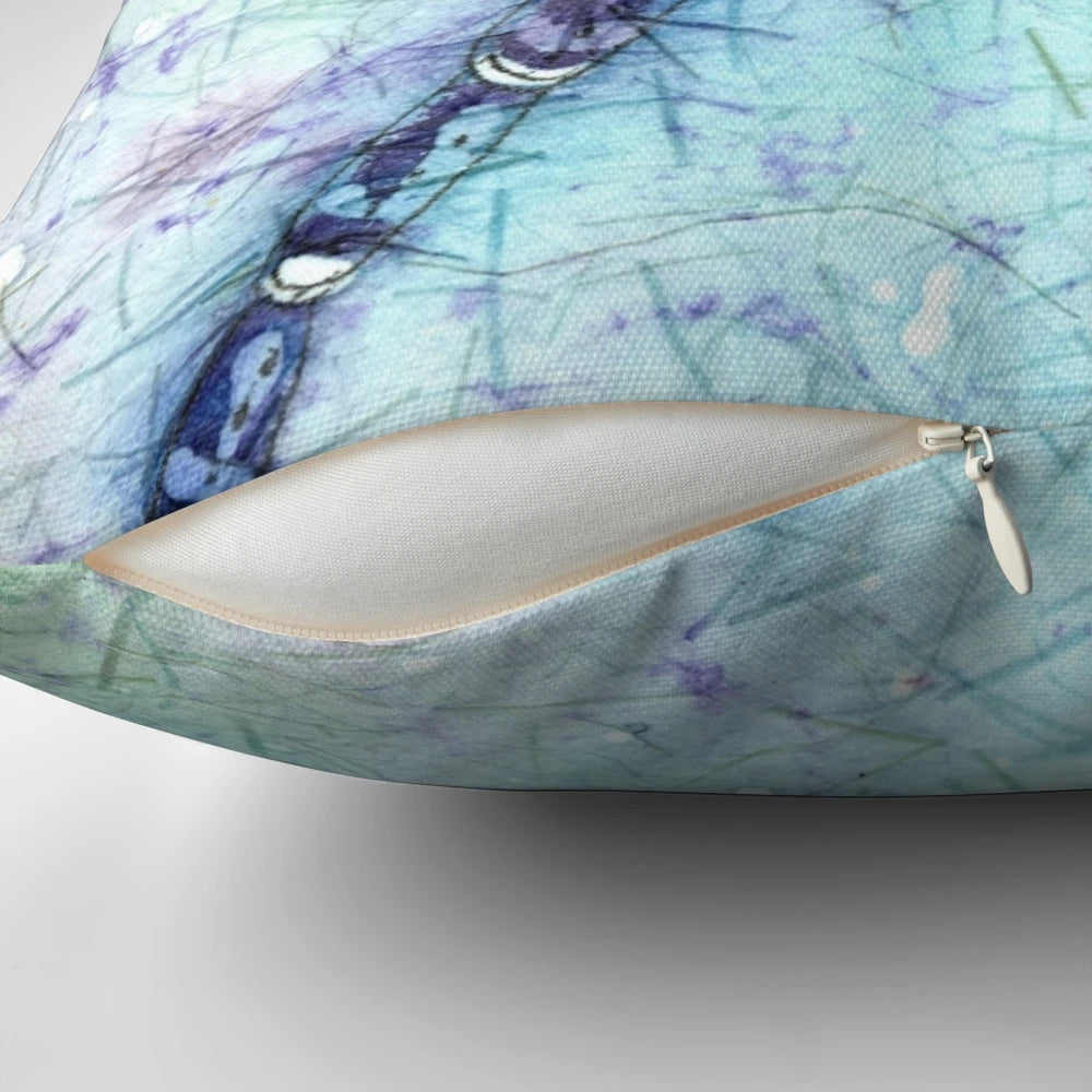 Vibrant watercolor painting of a dragonfly on a decorative throw pillow