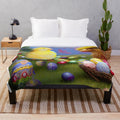Colorful Easter plush blanket featuring bunnies, chicks, and spring flowers