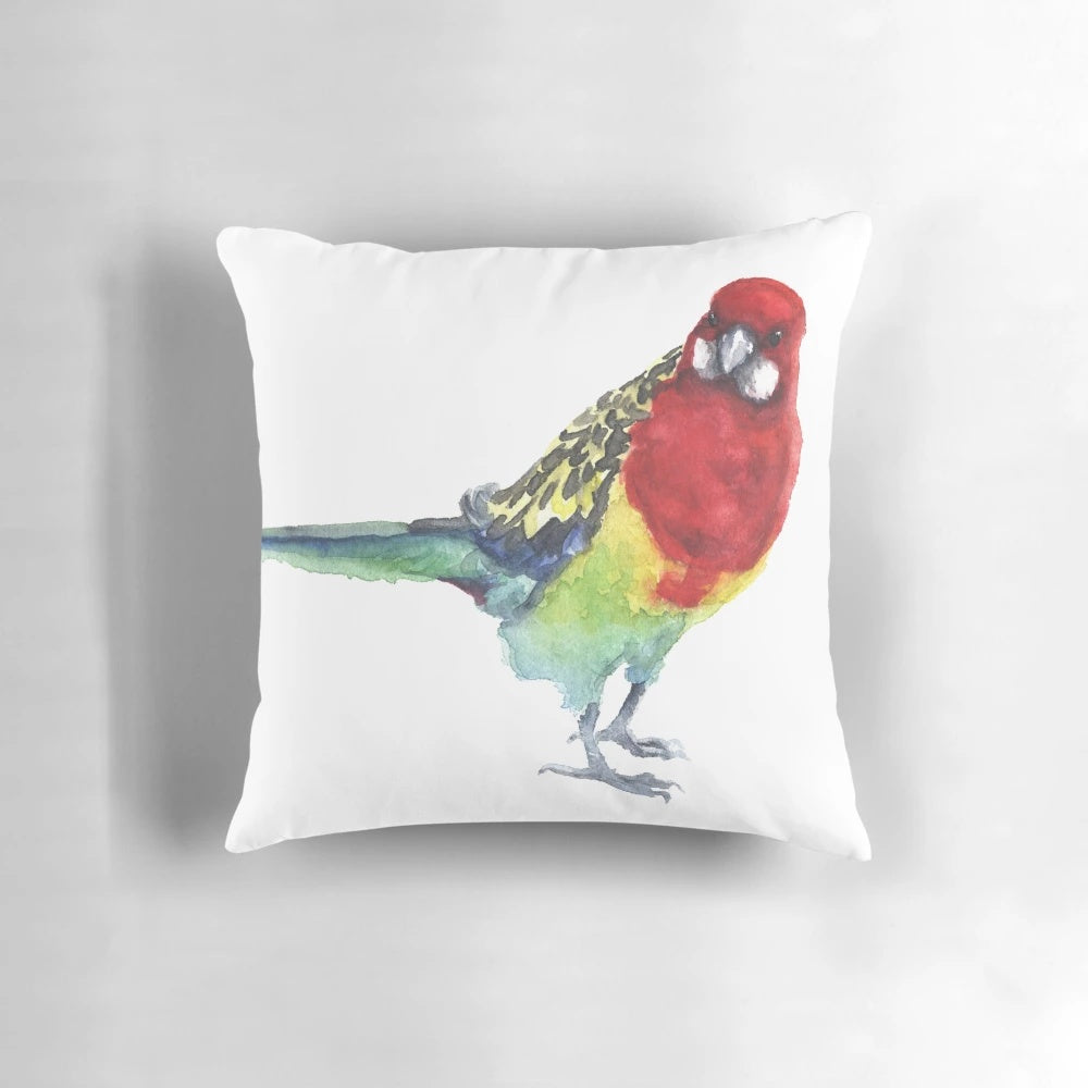 Closeup of a beautiful eastern rosella parrot on a watercolor-style throw pillow.