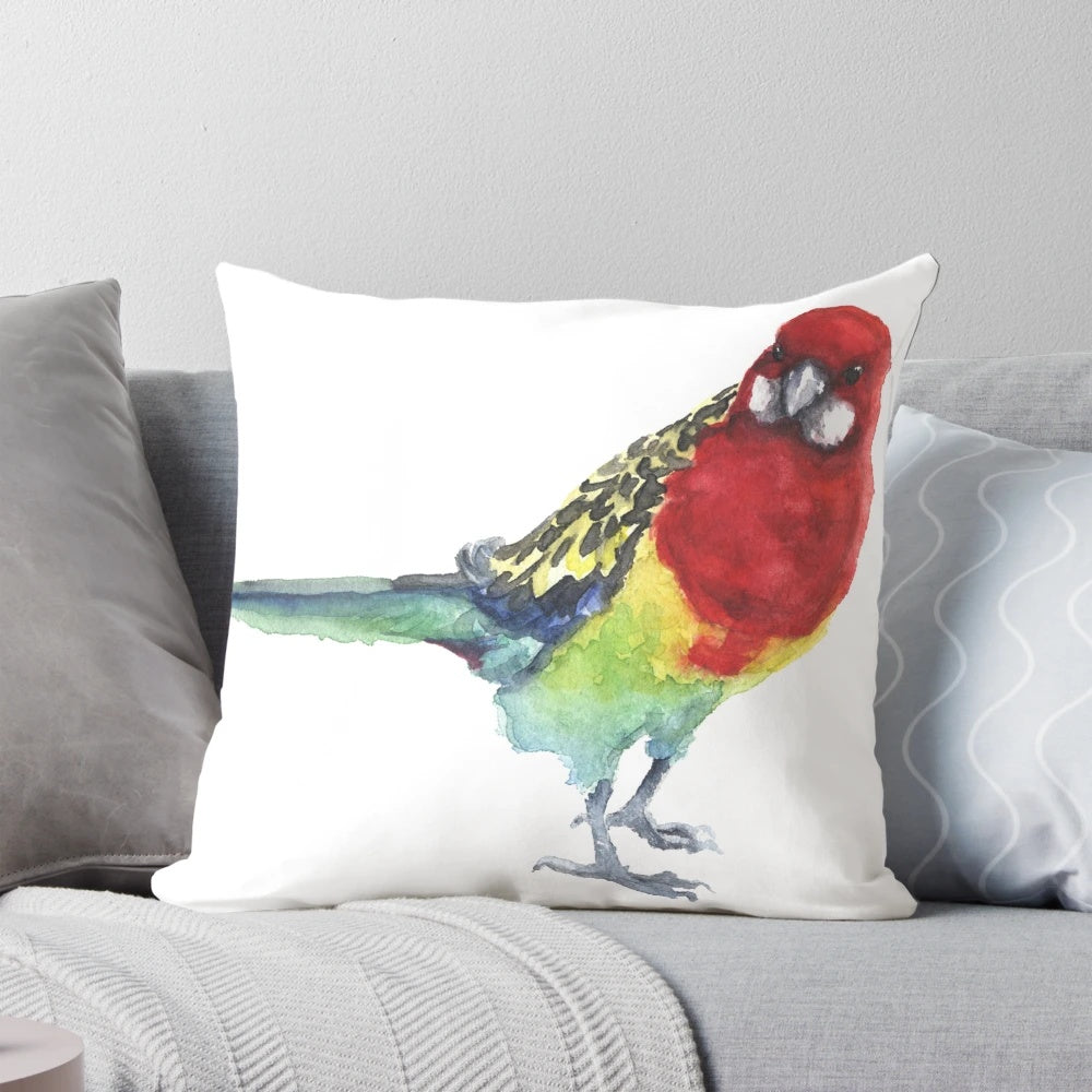 Closeup of a beautiful eastern rosella parrot on a watercolor-style throw pillow.