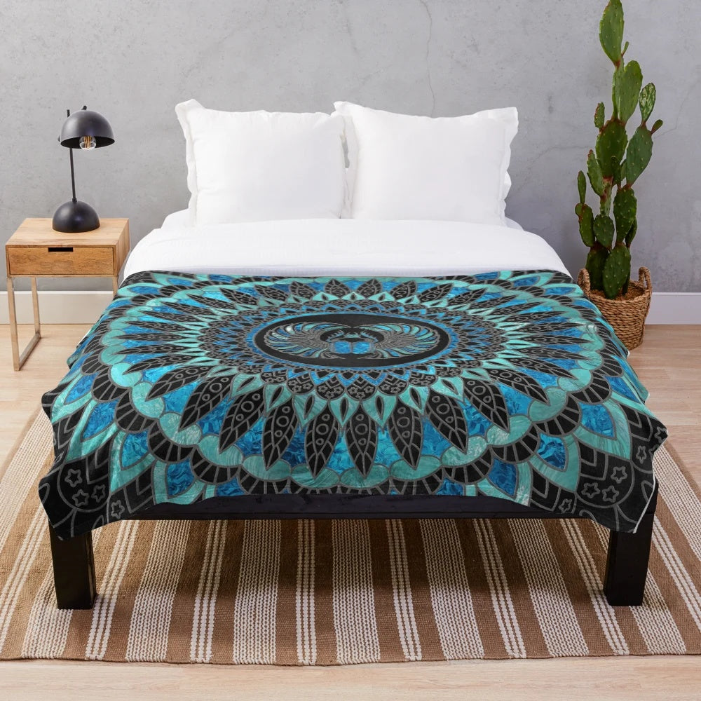 Gold and blue plush blanket with Egyptian scarab beetle design
